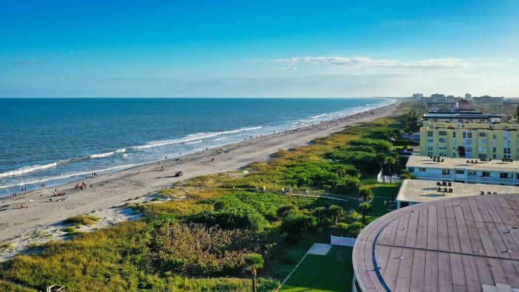aerial view of Cocoa Beach, Florida with people on the beach