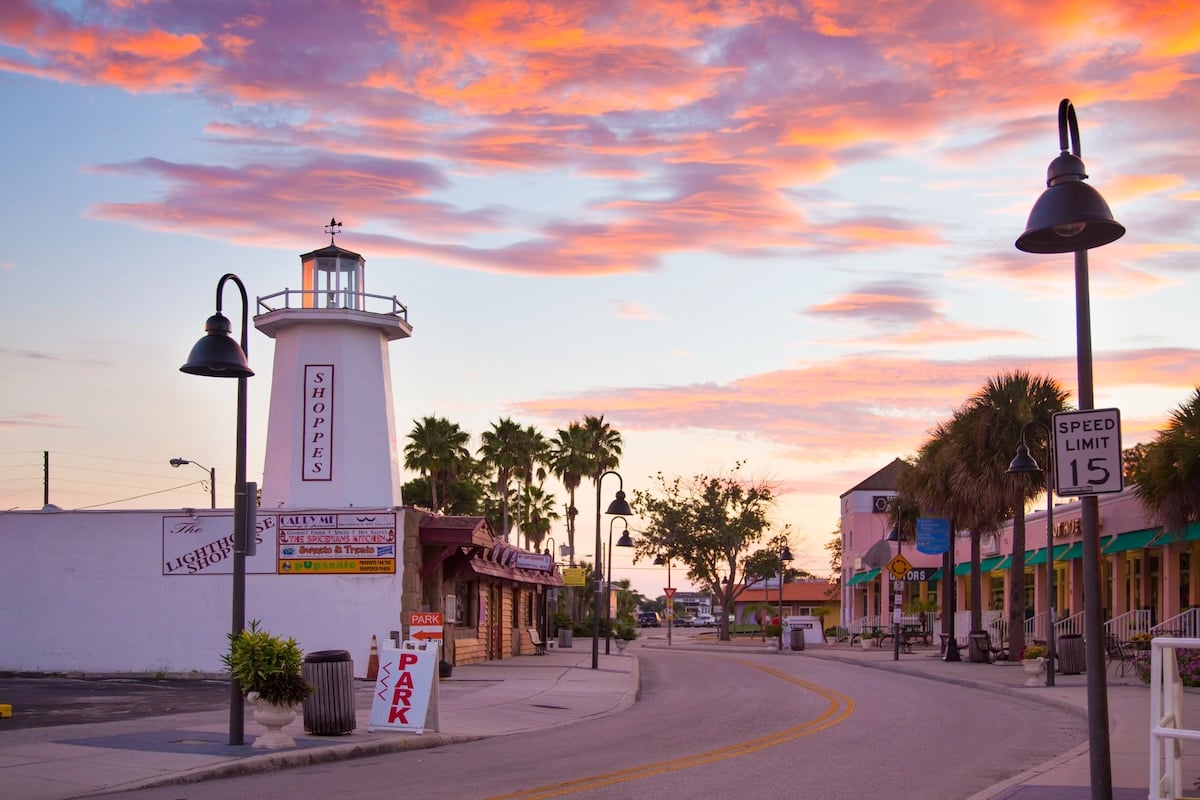 Sunset over historic downtown Tarpon Springs, Florida, with the lighthouse